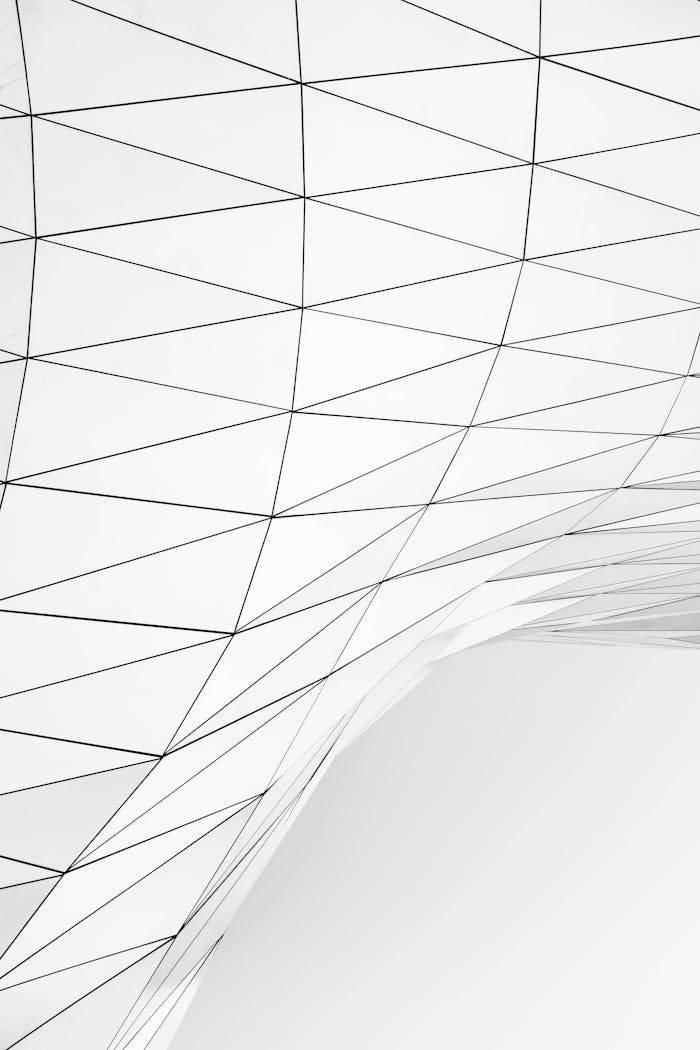 Minimalistic abstract design featuring white geometric lines on a curved surface.